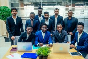 international business company of nine african american and indian people developing a strategy of ecology building modern office.