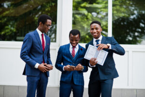 Three african american happy successful mans at suit with diploma at graduation day.